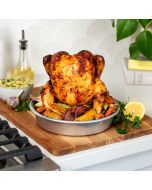 A whole roasted chicken placed on a cutting board, highlighting its appetizing appearance and inviting aroma.