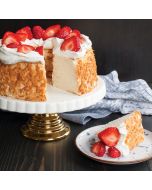 A strawberry cheesecake cake with a slice removed, showcasing its creamy texture and vibrant strawberry topping.