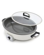 image shows GreenPan Elite 5.5-Quart Oval Electric Skillet | Cream  against a blank, white background 