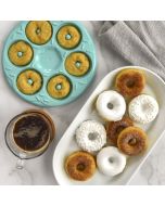 A plate featuring an assortment of colorful donuts alongside a steaming cup of coffee.