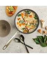 A bowl of soup filled with mushrooms and assorted vegetables, showcasing a warm and hearty meal