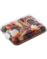 A wooden tray filled with assorted cheeses, fresh fruits, and mixed nuts arranged artfully for a gourmet presentation.