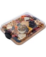 A tray filled with an assortment of colorful foods, including fruits, vegetables, and various dishes.