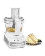 Cuisinart Core Custom 10 Cup Multifunction Food Processor with nuts inside next to a nutcake