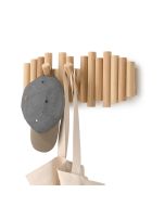 A hat and bag are hanging on a rustic wooden rack, showcasing a simple and organized storage solution.