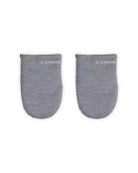 Le Creuset Mitts against a white background, shot directly from above  from the front. A LE Creuset Logo is stitched in white. 