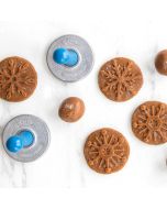 Stamping dough with Nordic Ware Snowflake Cookie Stamps