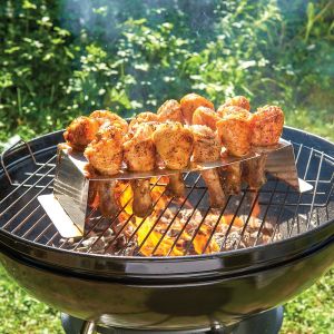 A grill featuring chicken legs being grilled, highlighting a savory outdoor cooking moment.