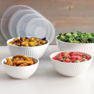 Four bowls filled with various types of food, showcasing a colorful assortment of ingredients and dishes.