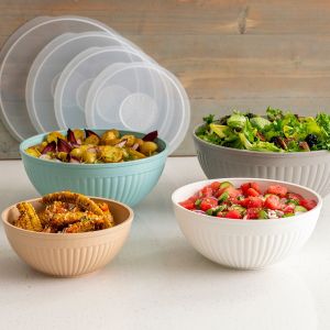 Four bowls filled with various types of food, showcasing a colorful assortment of ingredients and dishes.