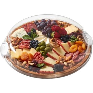 A wooden tray filled with assorted cheeses, fresh fruits, and mixed nuts arranged artfully for a gourmet presentation.
