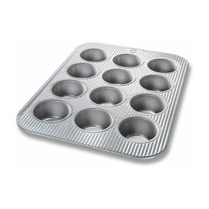 image shows USA Pan 12-Cup Muffin Pan against a blank, white background