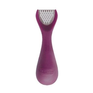 here we a ginger peeler/slicer/grater laying flat on a white background 