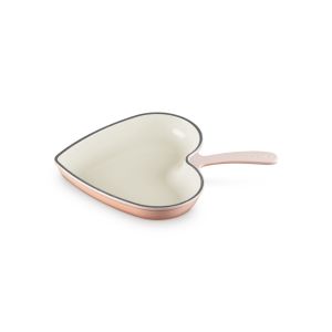 image shows Le Creuset Traditional 10.25" Heart Skillet | Pêche against a blank, white background