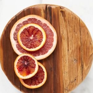 etúHOME Classic 9" Round Trivet | Natural with slices of grapefruit