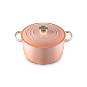 Le Creuset Signature 6.5 Qt. Enameled Cast Iron Deep Round Dutch Oven in Peche against a white background - side above