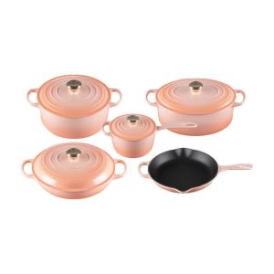 image shows Le Creuset 9 Piece Signature Set, Peche (5.5 qt, Sig. RDO, 6.75 qt. Sig. ODO, 3.5 qt. S against a blank, white background