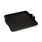 A person uses a griddle to make pancakes, topping them with blueberries as they cook. Image