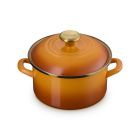 image shows Le Creuset 3.8 Qt. Petite Enamel On Steel Stockpot | Persimmon with Gold Knob  against a blank, white background Image
