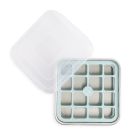 A person holds a square tray with a brownie, using the Nordic Ware Brownie Buddy Baking Pan and inclusion cutter for even slices. Image