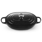 Le Creuset Signature 3.75 Qt. Oval Casserole against a white background shot from the side slightly above Image
