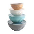 Four bowls filled with various types of food, showcasing a colorful assortment of ingredients and dishes. Image