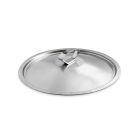 A pan with a wooden spoon beside a bowl filled with fresh strawberries on a kitchen countertop. Image