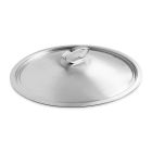A covered pan with a wooden spoon rests on a white countertop, ready for cooking or serving a meal.
 Image
