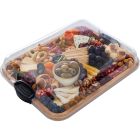 A tray filled with an assortment of colorful foods, including fruits, vegetables, and various dishes. Image