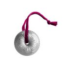 Two shiny metal ornaments hang from a decorated Christmas tree, reflecting light and adding festive charm. Image