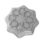 Sliced cookies arranged on a blue plate adorned with snowflake patterns, creating a festive and inviting display. Image