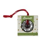 A collection of colorful Christmas ornaments hanging from a decorated tree, creating a festive holiday atmosphere.
 Image