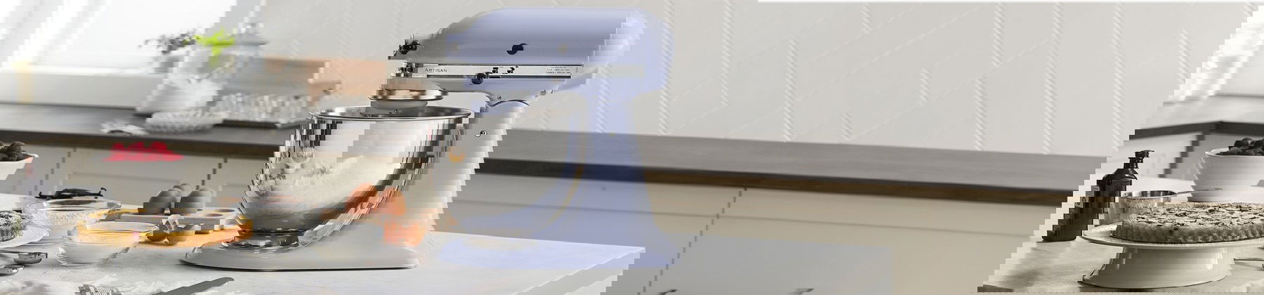 Photo of a KitchenAid Sheet Cutter Attachment cutting sweet potatoes on a KitchenAid mixer. 