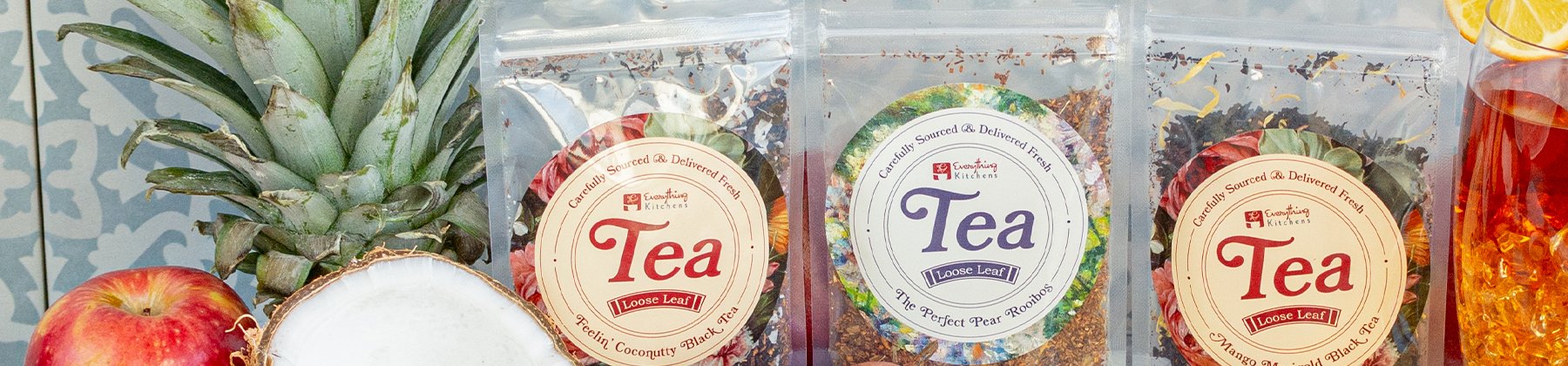 Photo of Everything Kitchens branded teas with fruit.