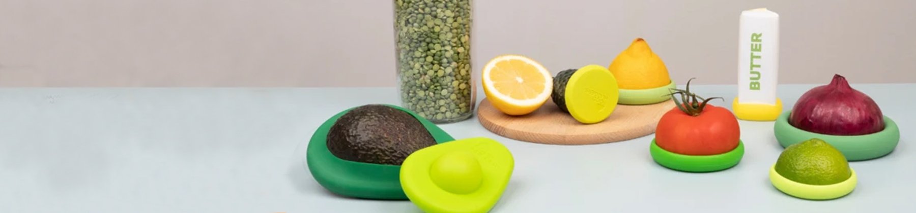 Photo of Food Huggers silicone covers on various vegetables.