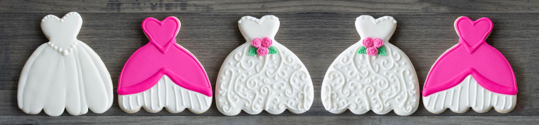 Photo of wedding dress shaped cookies.