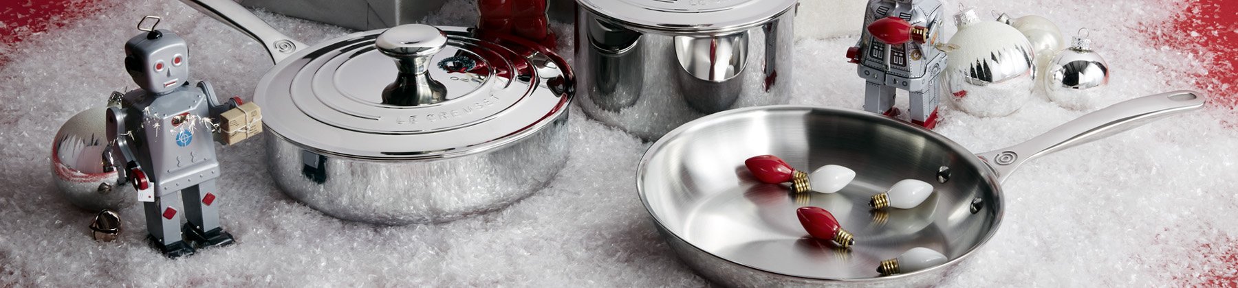 Photo of Le Creuset stainless steel cookware with holiday decor.