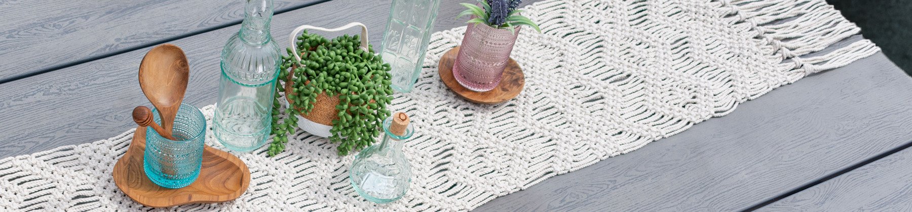 Photo of Everything Kitchens exclusive collection, macrame tabletop runner.