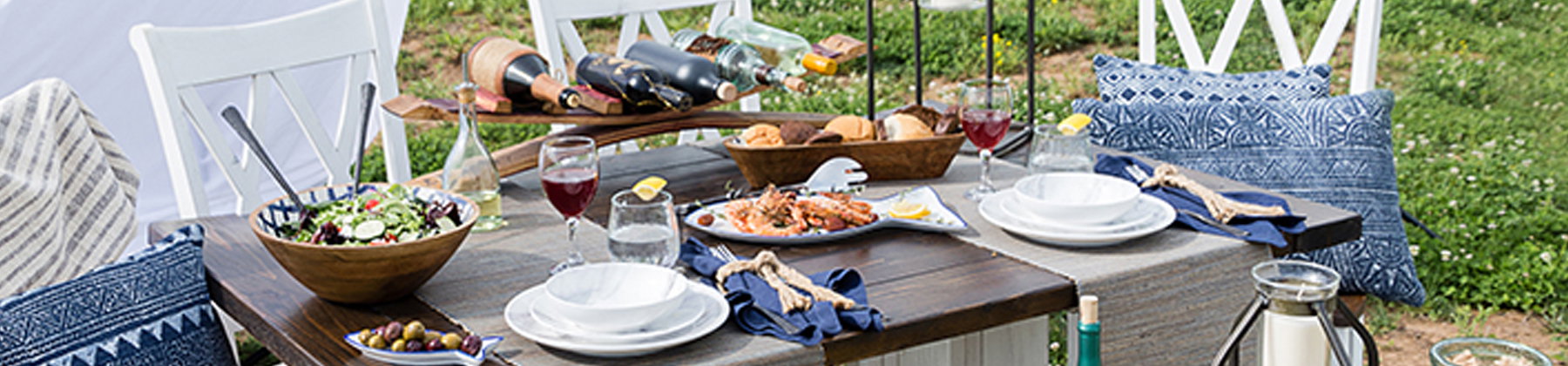 Photo of outdoor nautical outdoor entertaining tablescape.