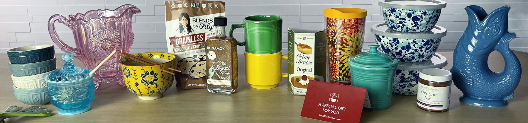 Photo of various small gifts on a table including an Everything Kitchens gift card.