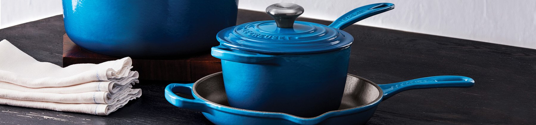 Photo of Le Creuset blue cookware set.